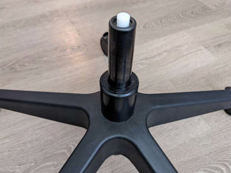 The gas lift’s white bushing seated into the base.