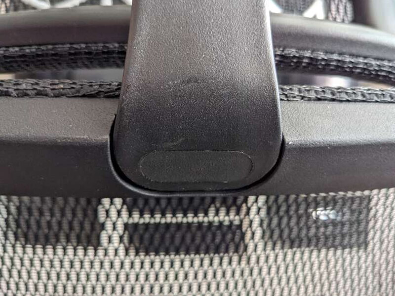 The cover snapped into place, headrest post running through it.
