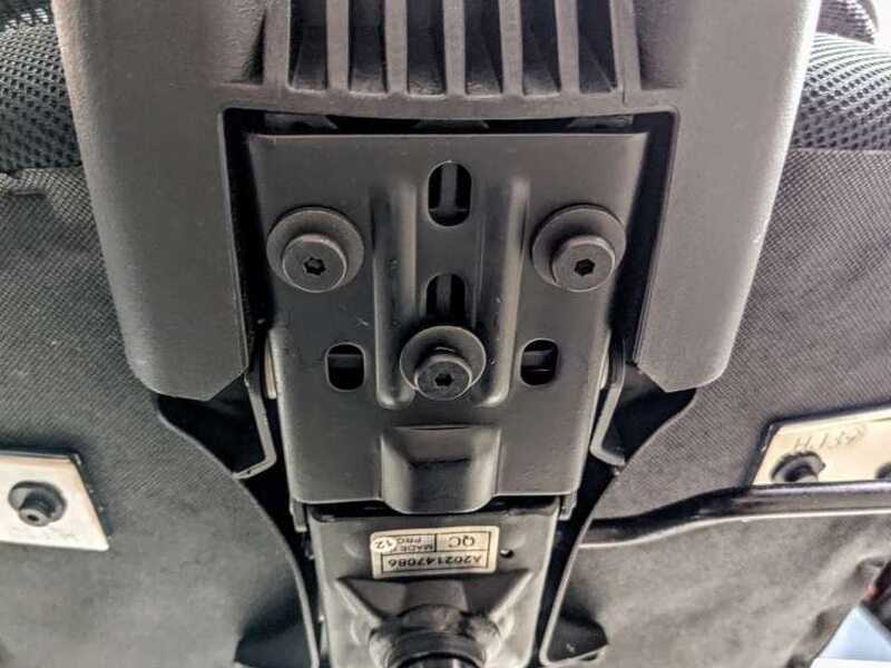 The three backrest bolts threaded into their bracket.