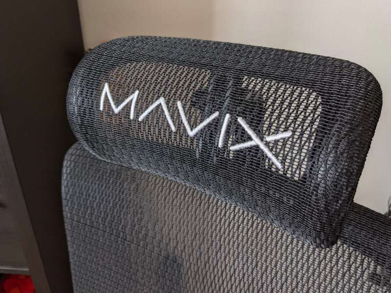 The headrest, MAVIX stitched in white across the mesh.