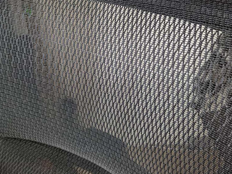 An extreme close-up on the mesh weave, backlit.