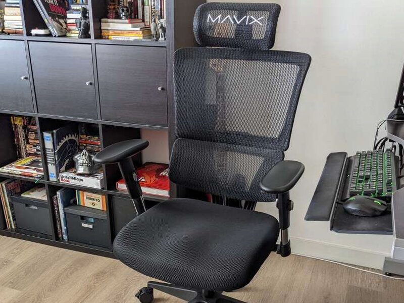 Reclined back against the shelving, backrest at an angle.