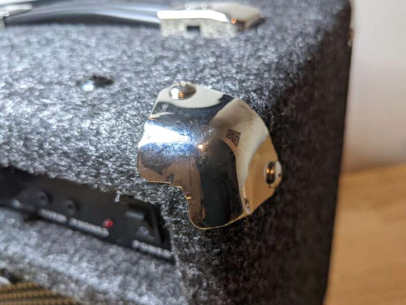 Metal corner caps protect the cabinet edges from bumps and scrapes.