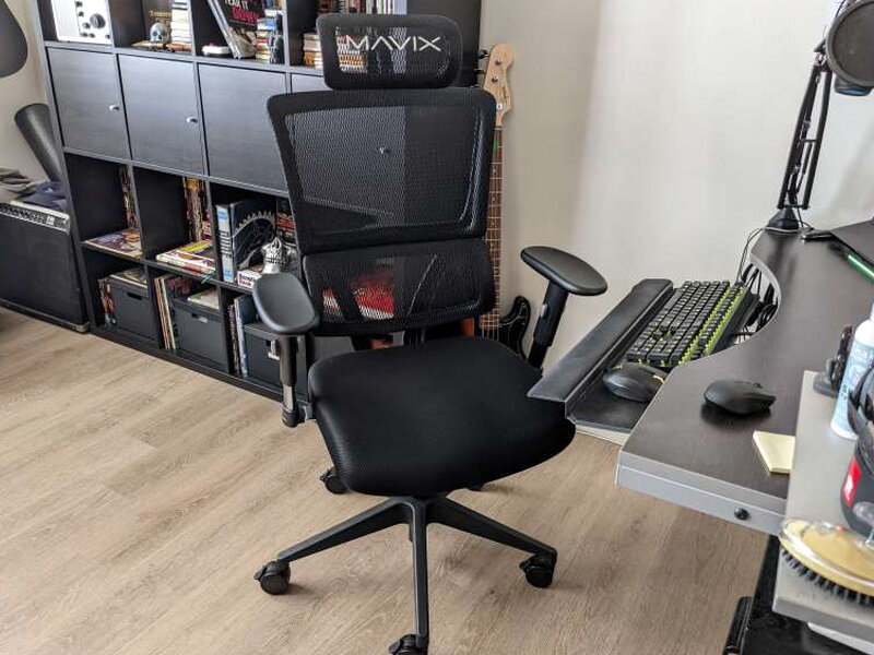 The M4 at the desk, an armrest raised near its max height.