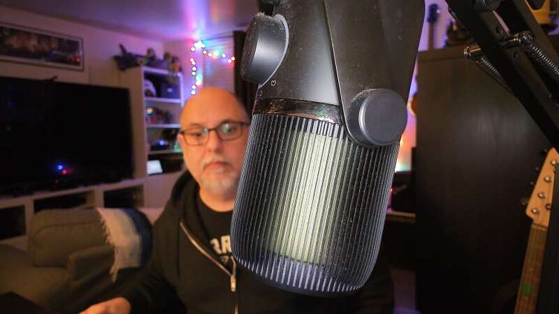 The SANNCE focusing closely on a microphone while the background softens.