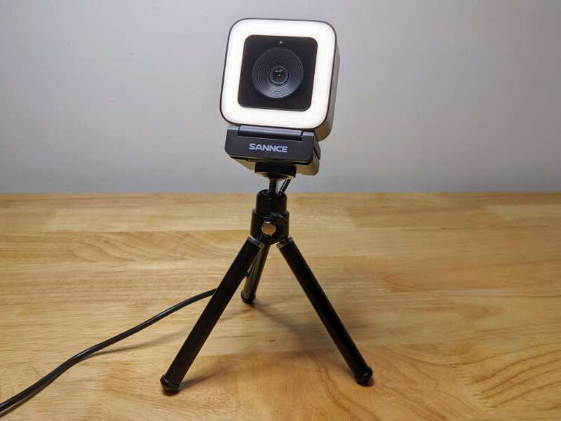 The SANNCE webcam mounted on the included tripod and ready for desk use.