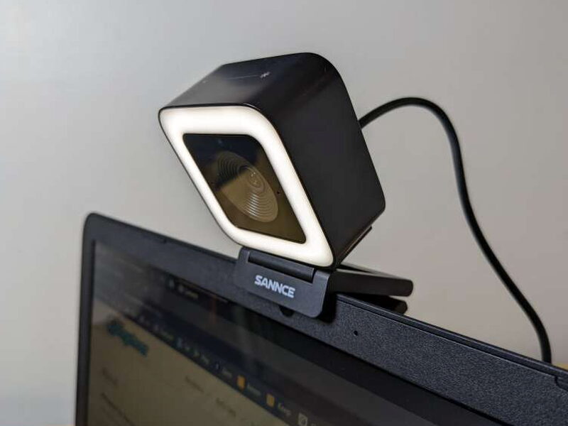 The SANNCE webcam angled on top of a laptop screen.