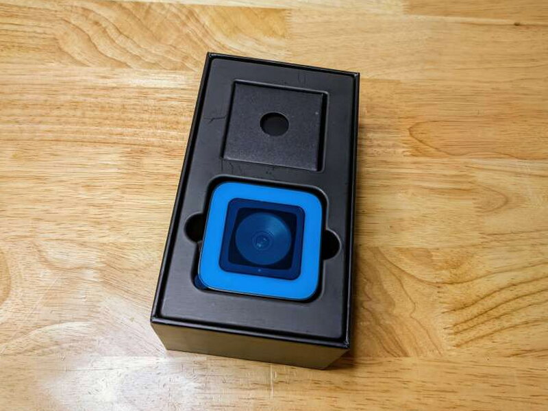 The webcam sits in a formed insert inside the opened package.