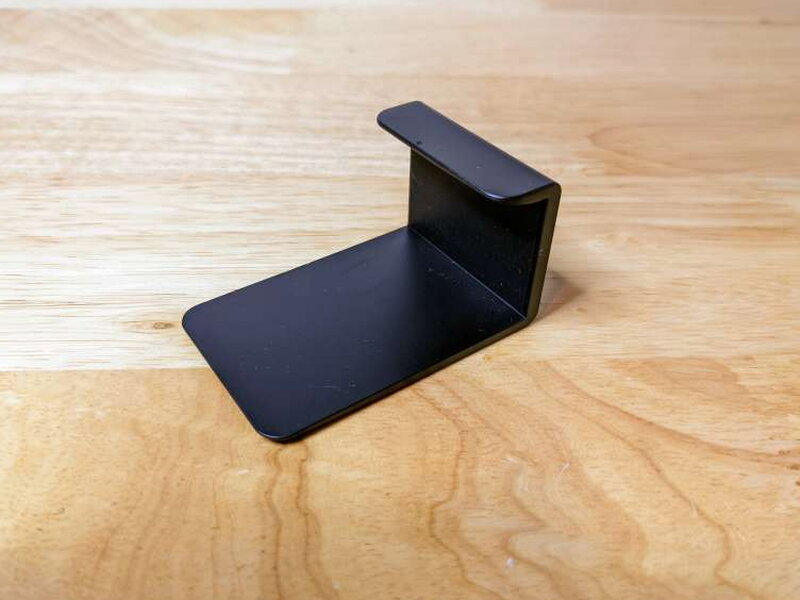 The separate J-shaped privacy shutter that clips over the lens.