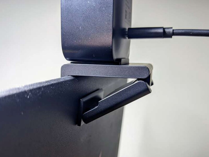 The bottom brace holds the mount against the back of a monitor or laptop screen.