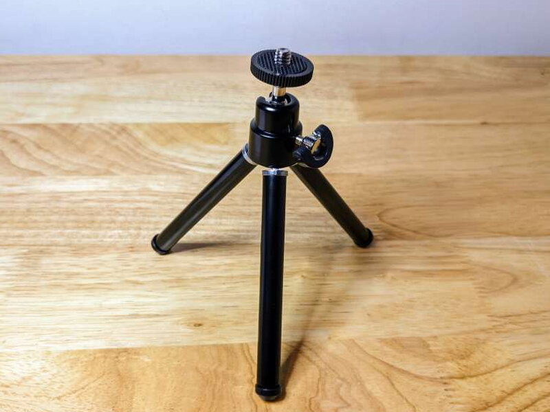 The included desktop tripod set up with its short legs.