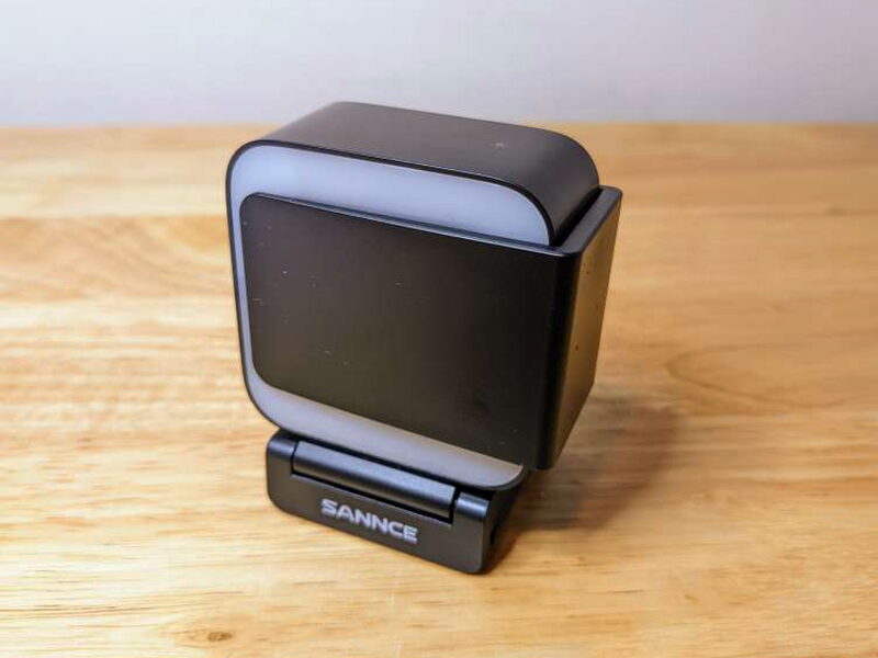 The privacy cover stored on the side of the webcam body.