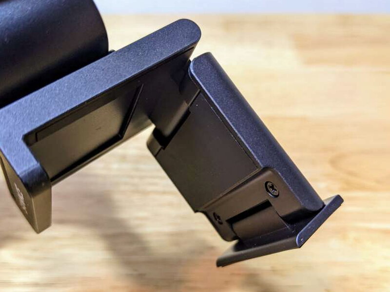 The hinged base opens wide to grip a display.