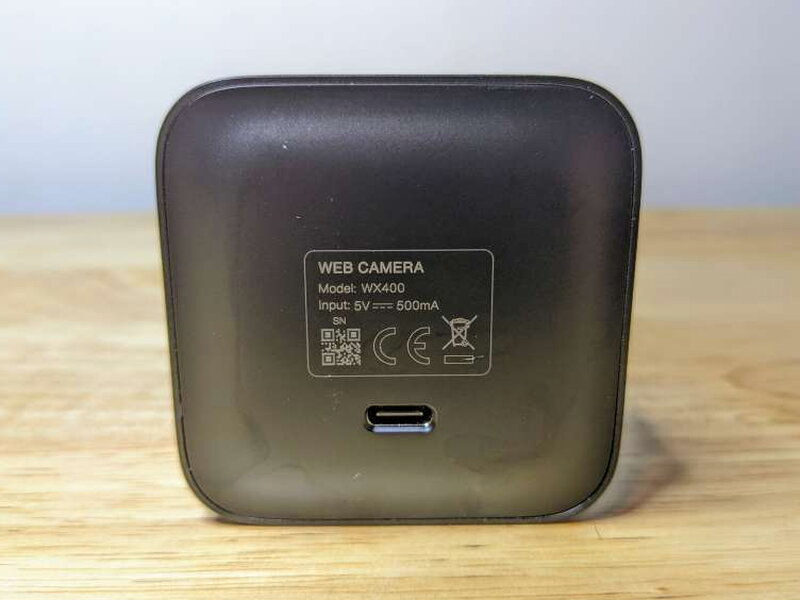 The rear label and USB-C port on the back of the webcam.