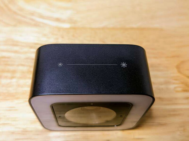 The top touch controls adjust the webcam light level.