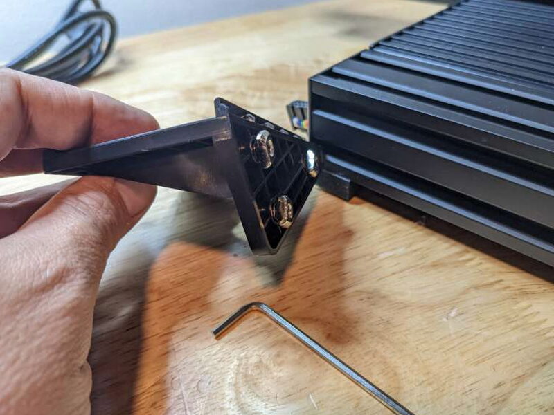 The control screen bracket slides into the side grooves on the printer base.