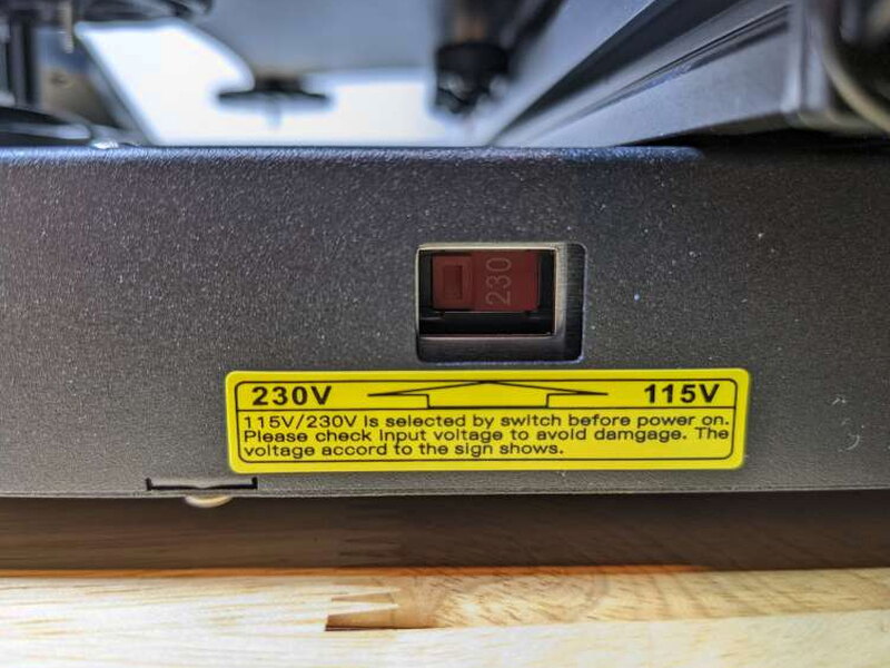 The voltage selector ships set to 230V and needs checking before power up.