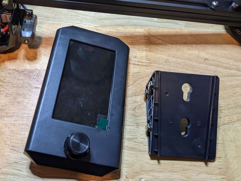 The control screen and its separate base mount before installation.