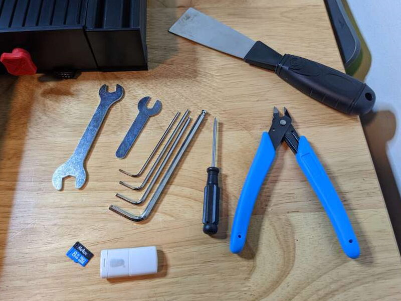 The included tools are useful for assembly, maintenance, and print removal.