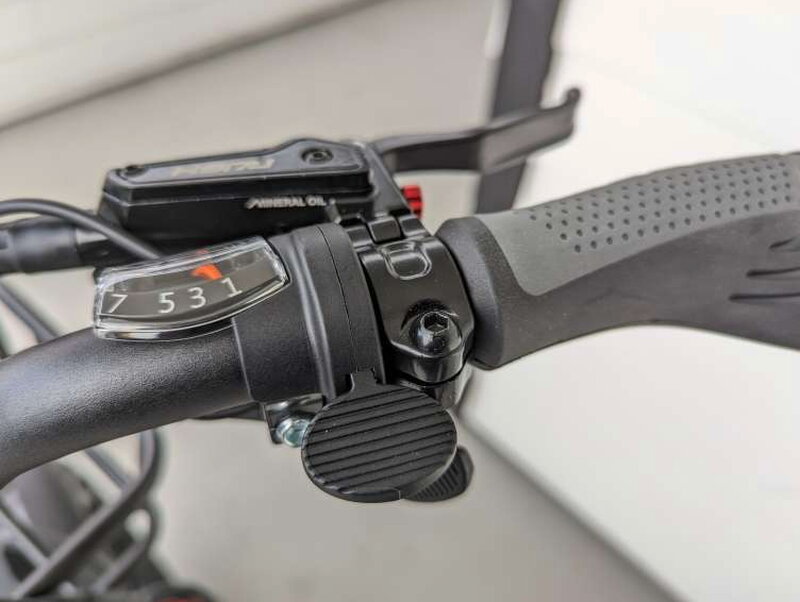 The Shimano gear indicator and right side thumb throttle.