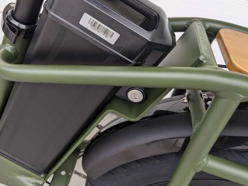 The removable battery mounted inside the low step frame.