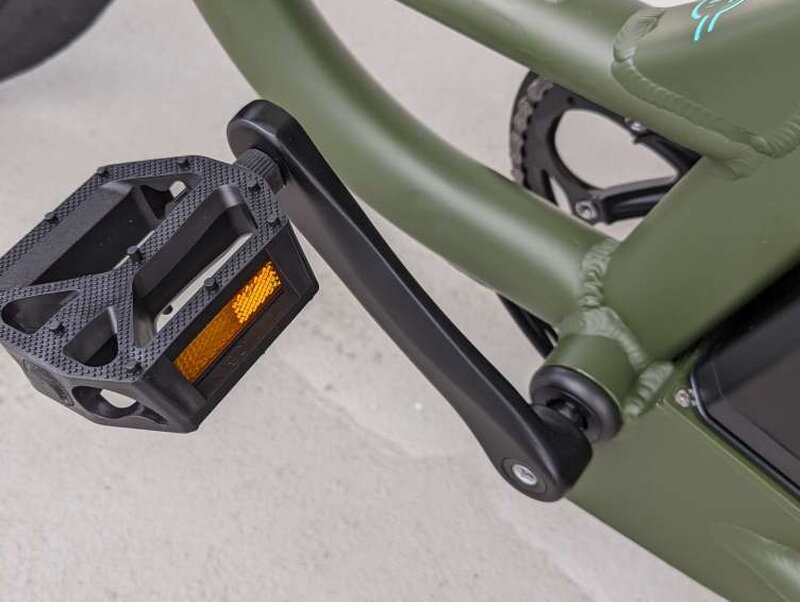 The stock plastic pedal, which was less grippy than expected.