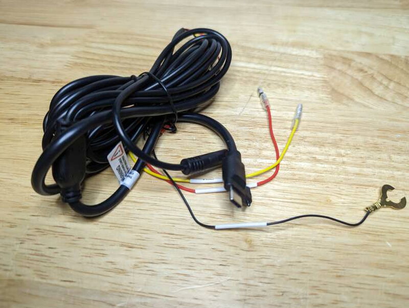 The hardwiring cable has red, yellow, and black leads for ignition power, constant power, and ground.