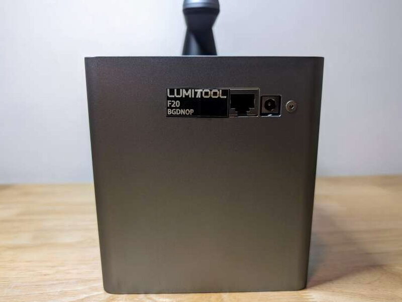 The back panel, with the data port linking head to stand and a small power port beside it.