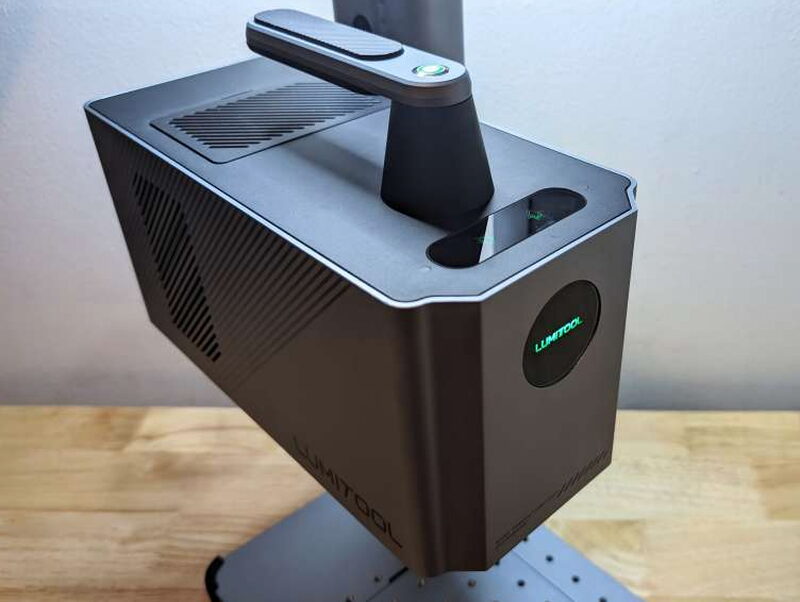 Powered on, the ring around the button glowing green.