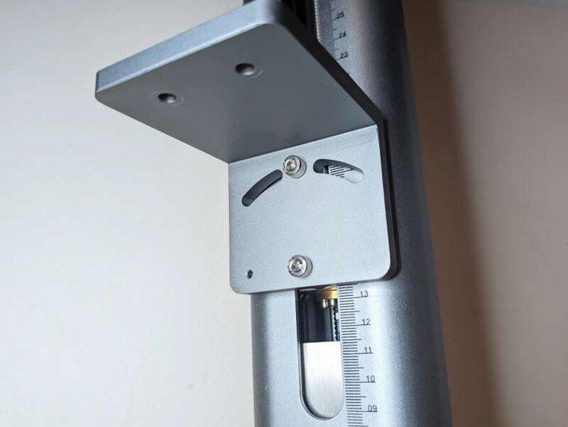 A closer look at that bracket and the two Allen bolts that set the laser’s tilt.