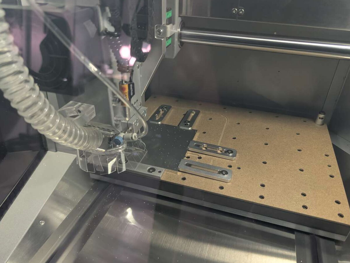 Engraved acrylic Spiderman panel and parts on the bed