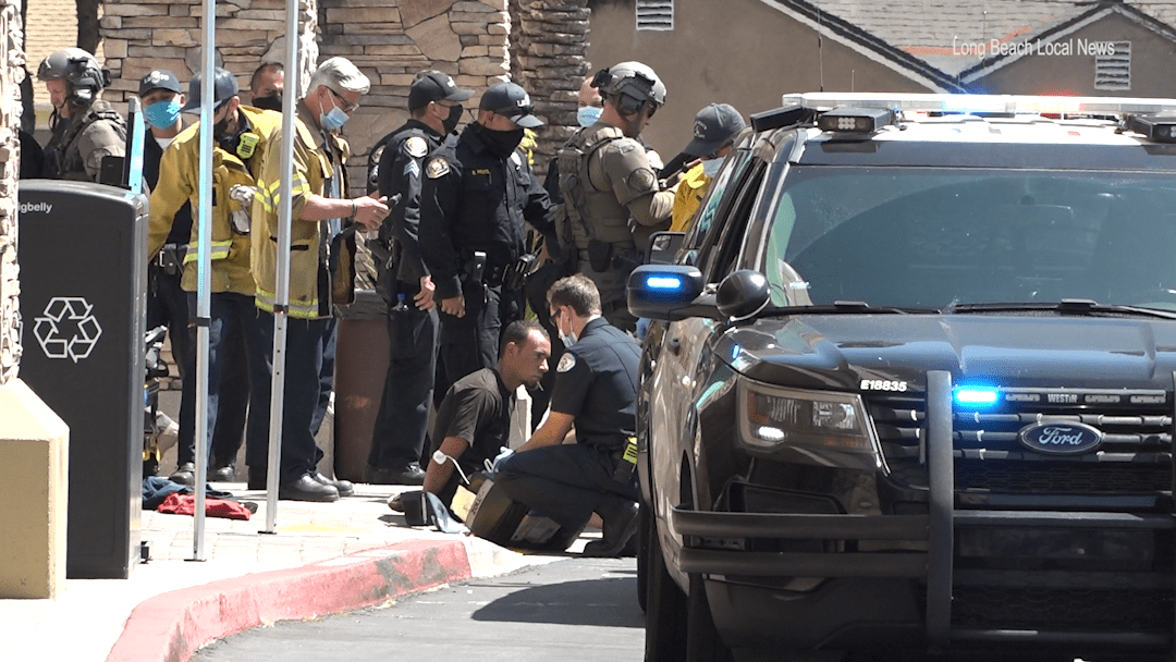 Suspect taken into custody after 4-hour standoff inside police vehicle