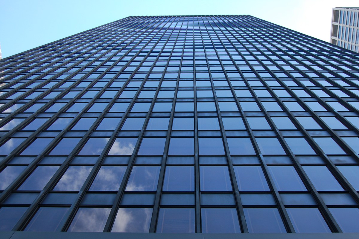 An upward view of the Seagram Building’s bronze and glass facade.