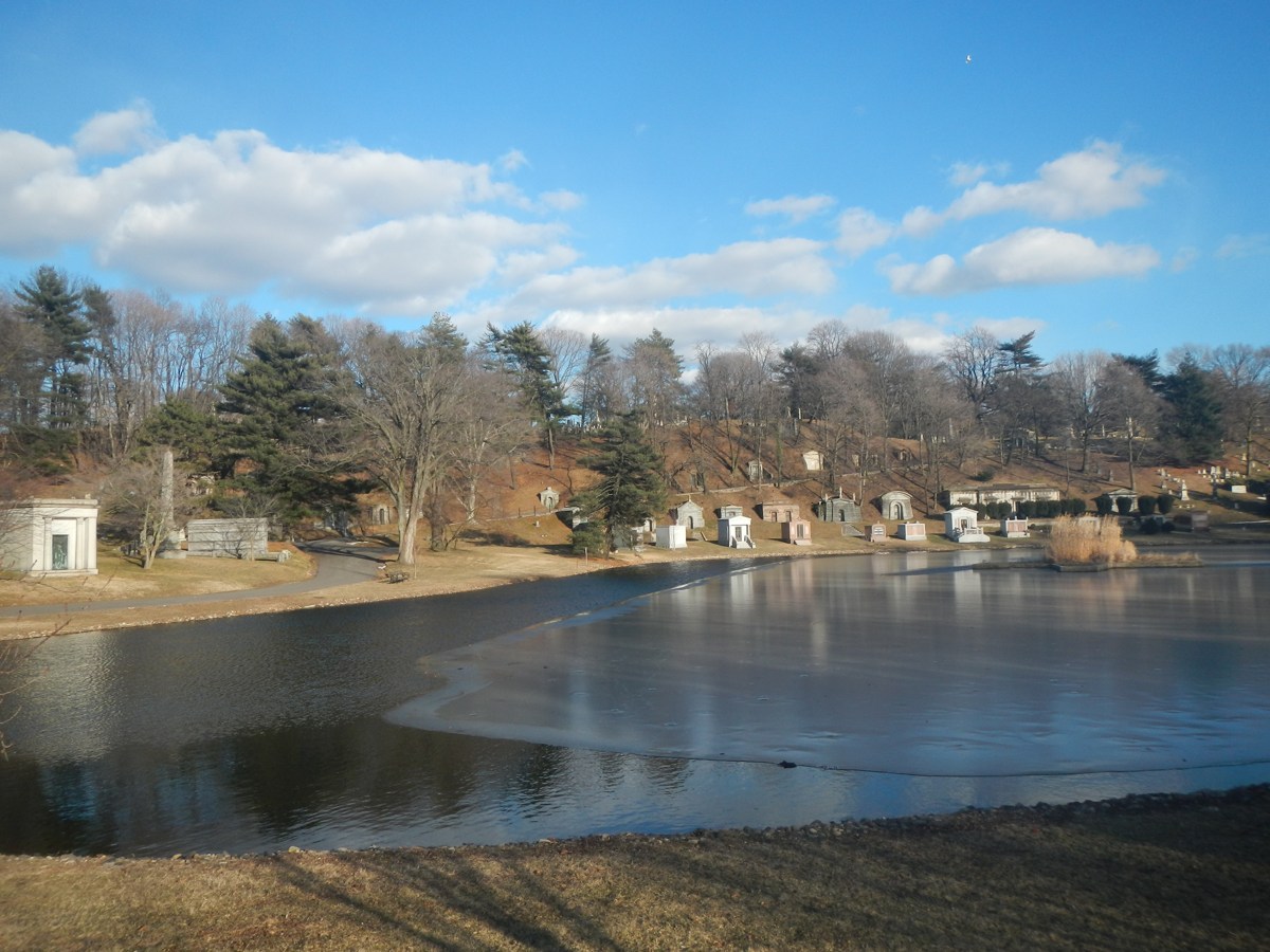 Sylvan Water at Green-Wood Cemetery in Brooklyn, surrounded by trees and monuments.
