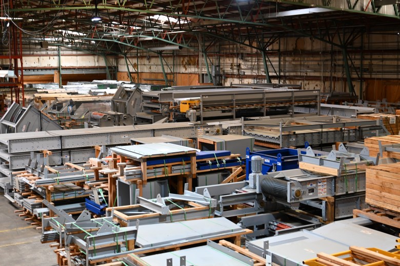 Equipment in storage at a Eugene warehouse designated for the CleanLane recycling project. Lane County contracted with Bulk Handling Systems to design and operate the facility.