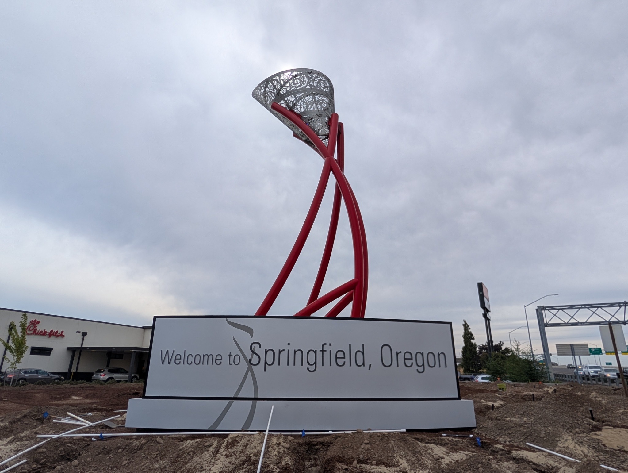 City installs ‘Welcome to Springfield’ sign on Gateway Street by ‘Flame’ sculpture