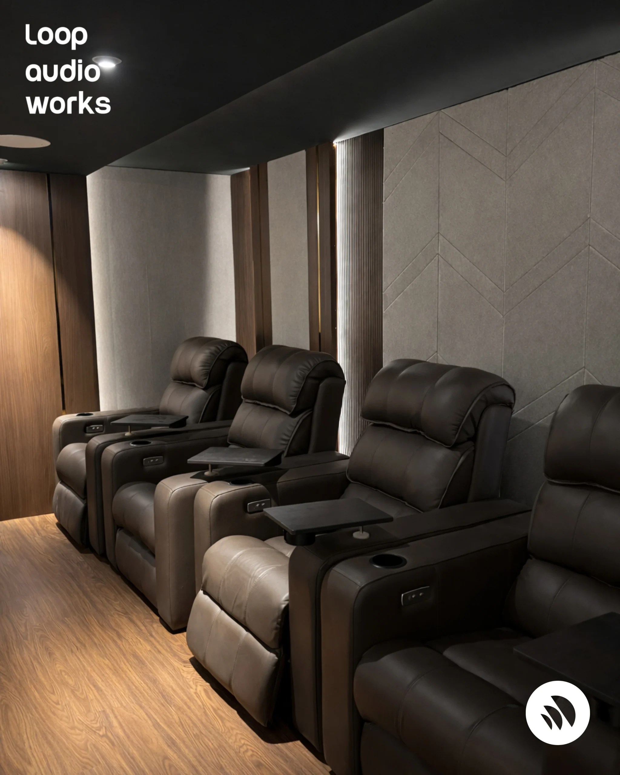 Home theatre seating with ambient lighting for immersive cinema experience by Loop Audio Works