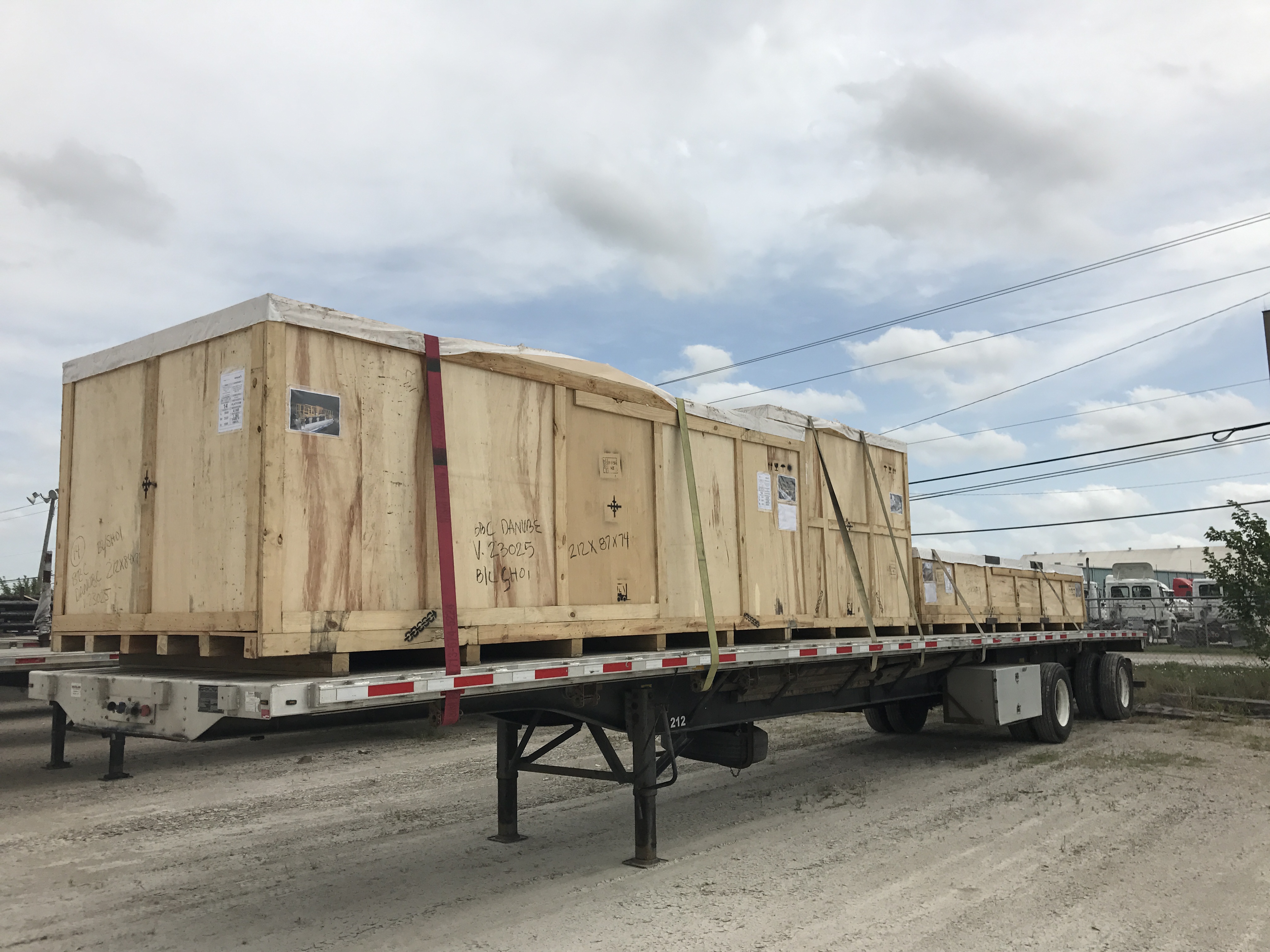 Open trailer cargo strapped