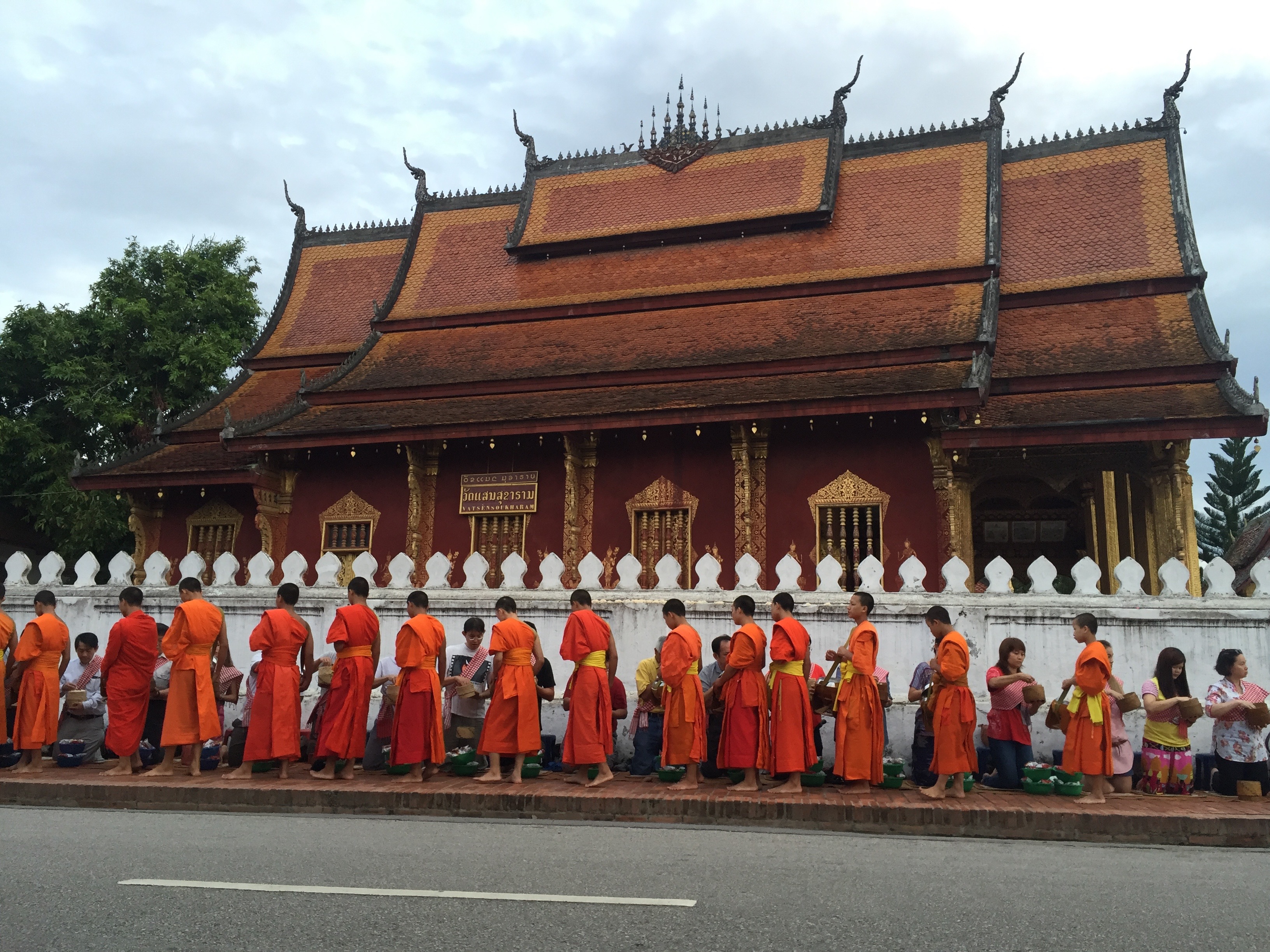 Monks collecting their breakfast alms.