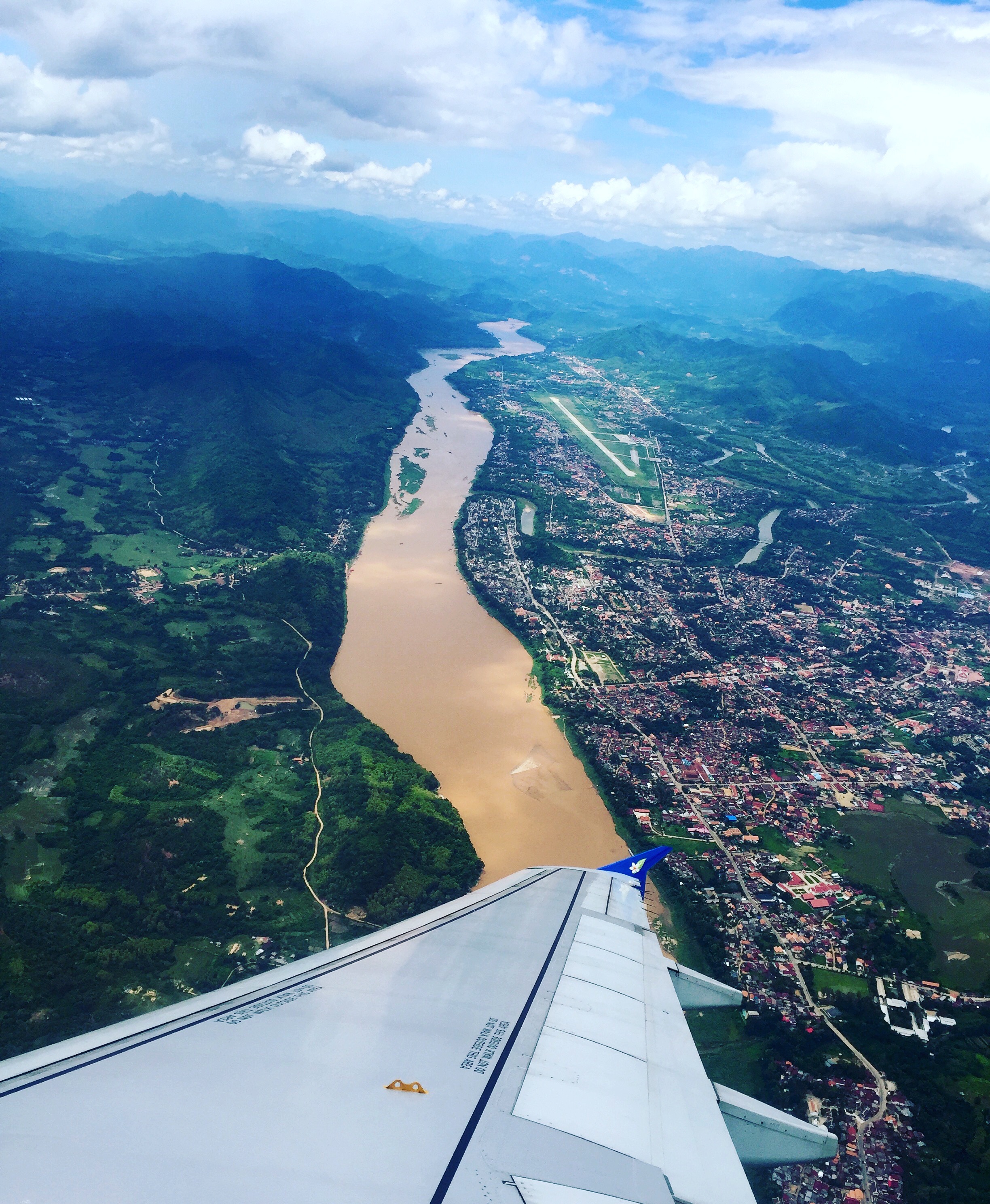 Flying over Luang Prabang. Doesn't the Mekong look like chai? <3