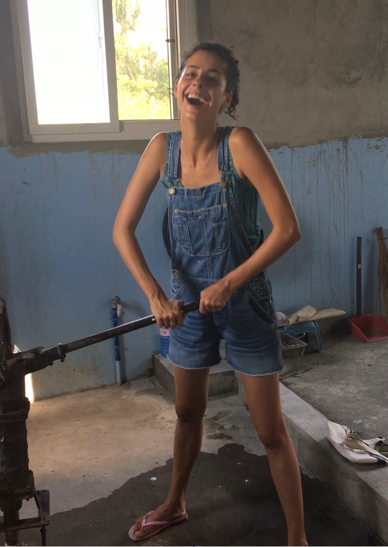 Pumping water for laundry and looking like I'm 12.