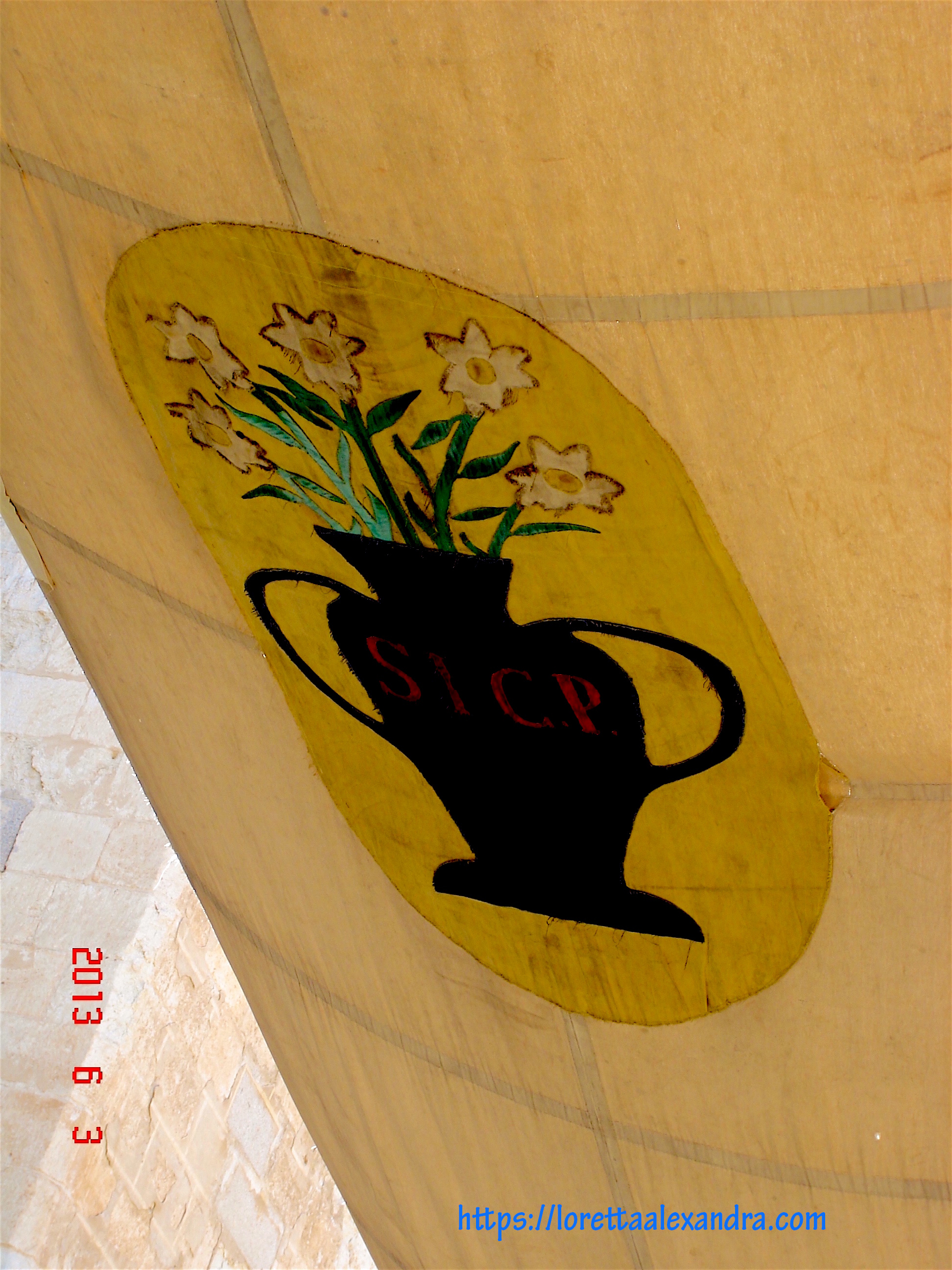 Canvas awnings are strung overhead to protect the religious procession celebrating Corpus Christi