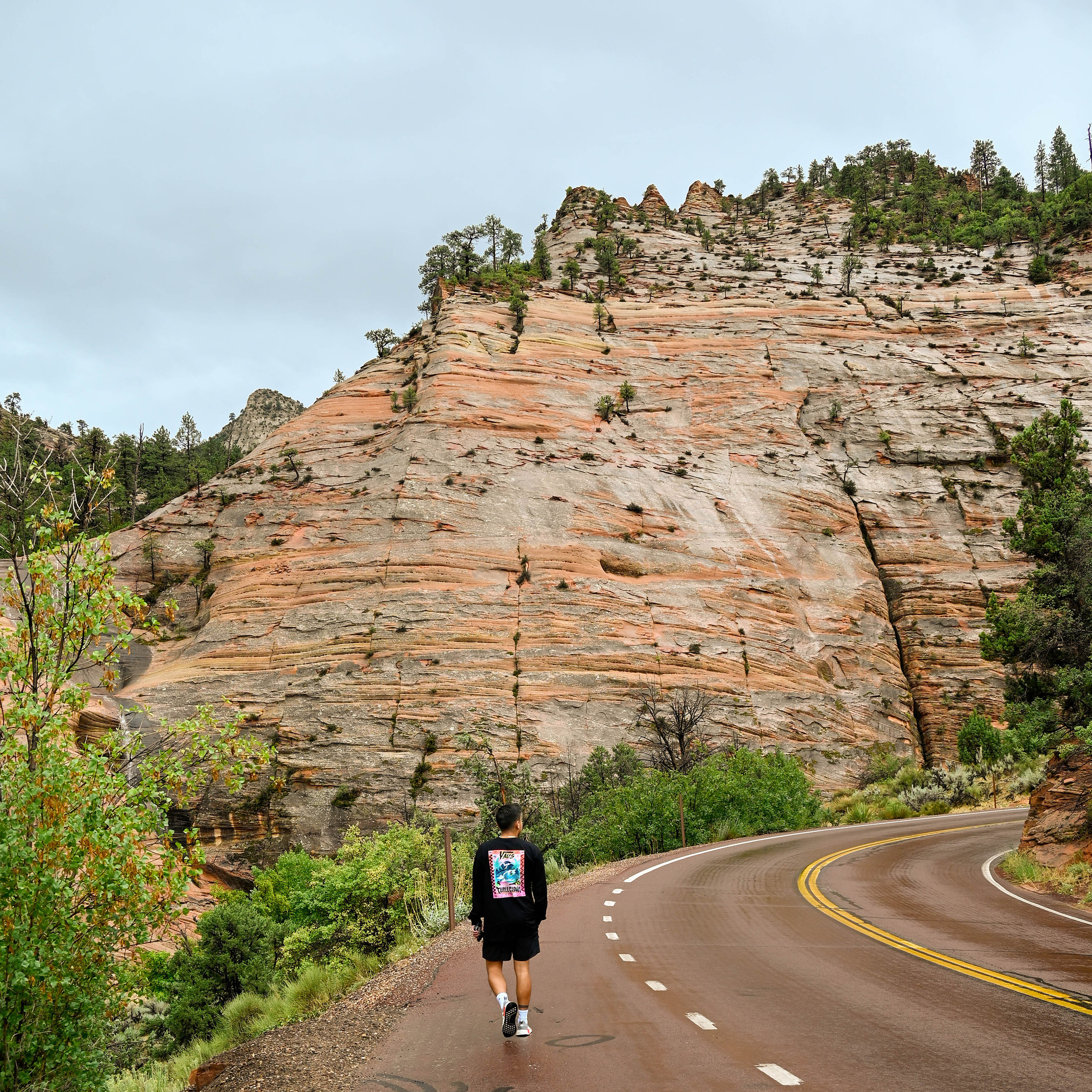 Erick Perez walking through a mountain landscape