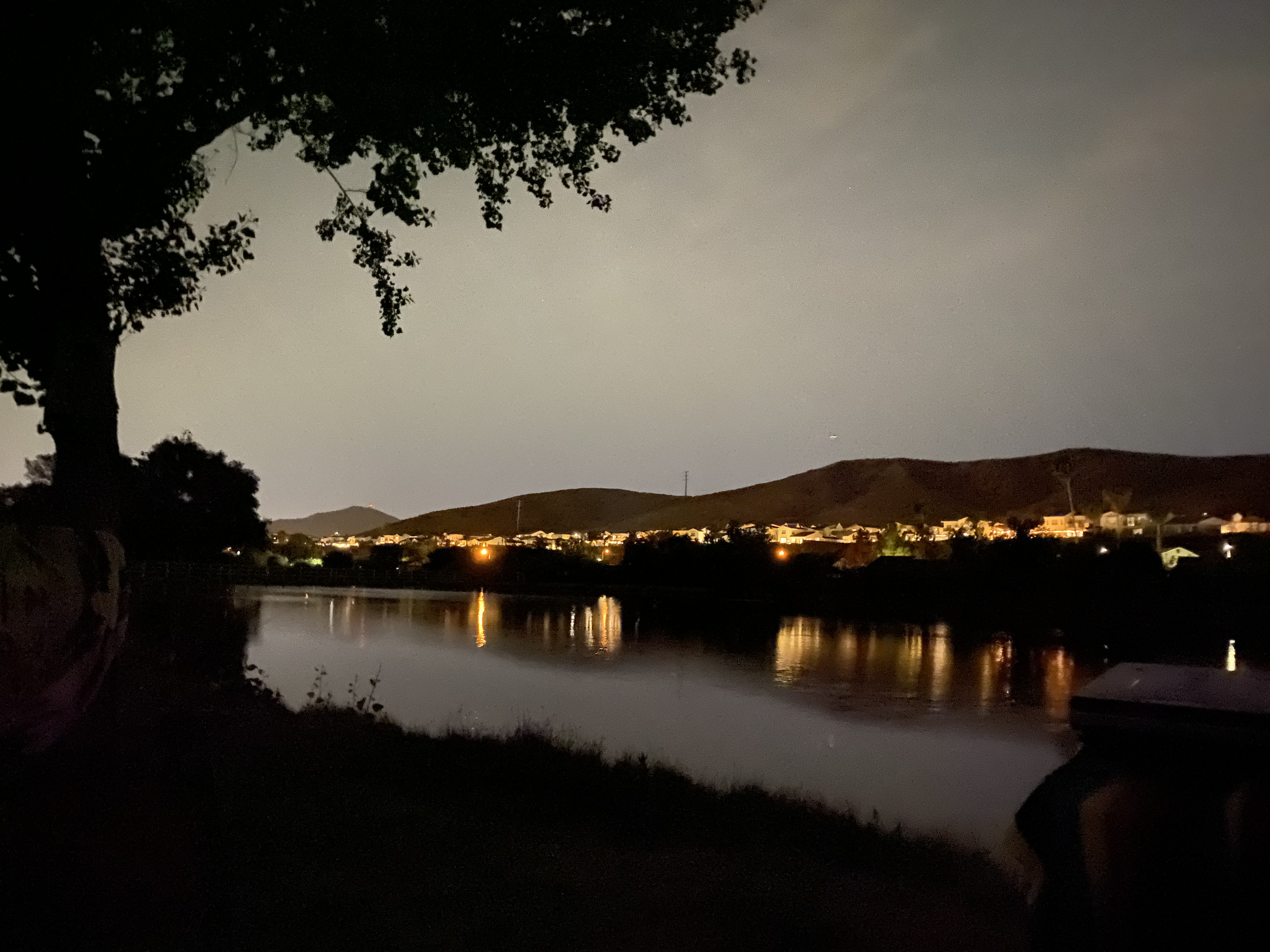 Lakeside with evening glow of homes