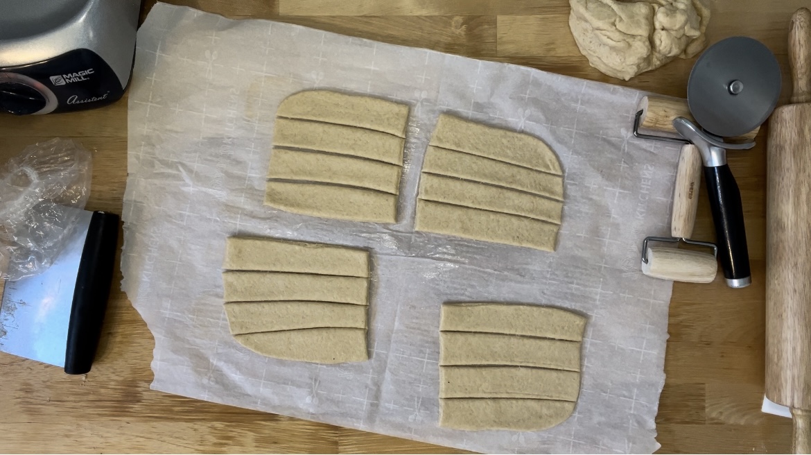 crescent roll dough in fourths with strips