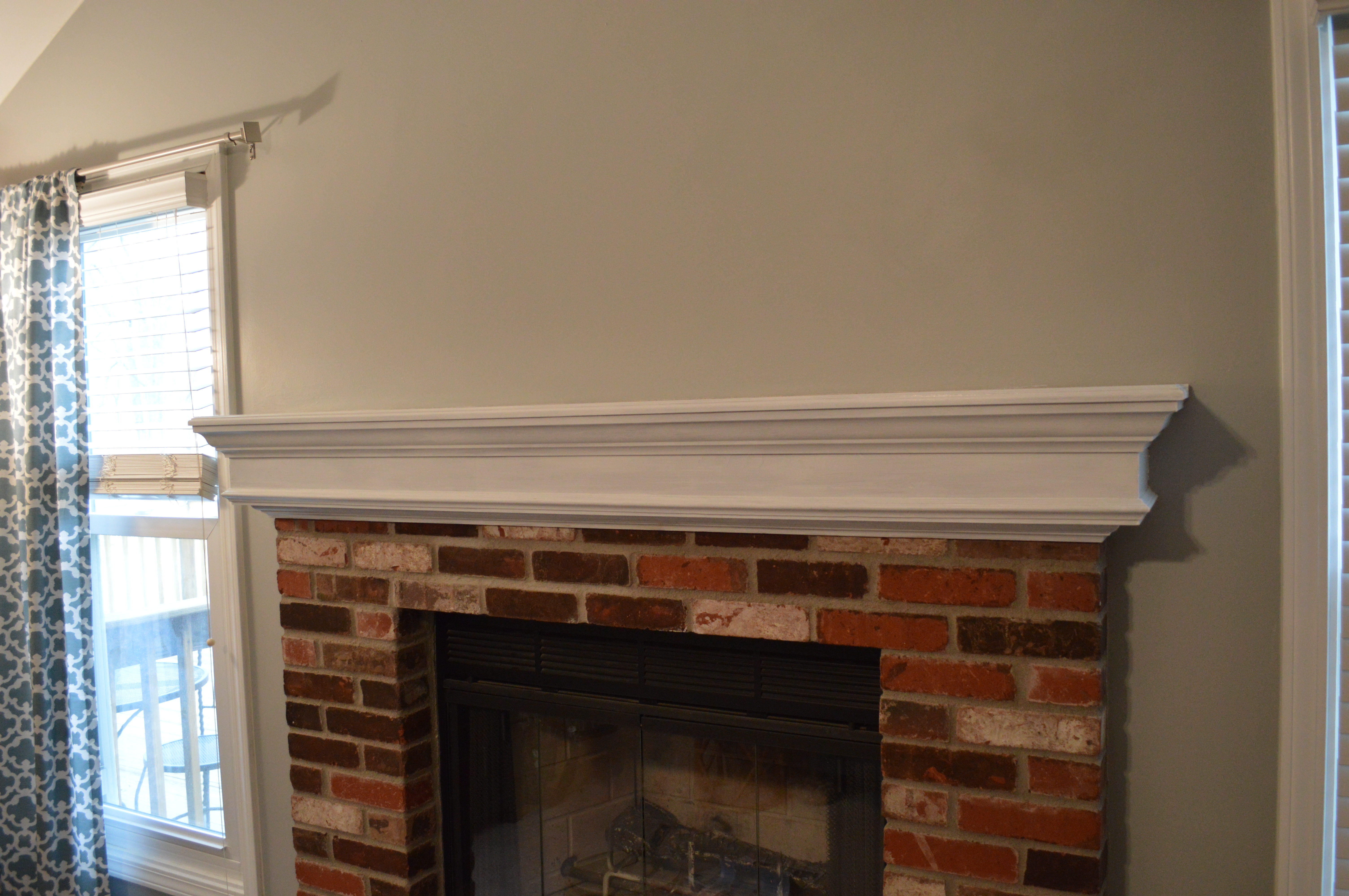 White Brick Fireplace With Mantel Ornaments And Green Rug High Res Stock Photo Getty Images