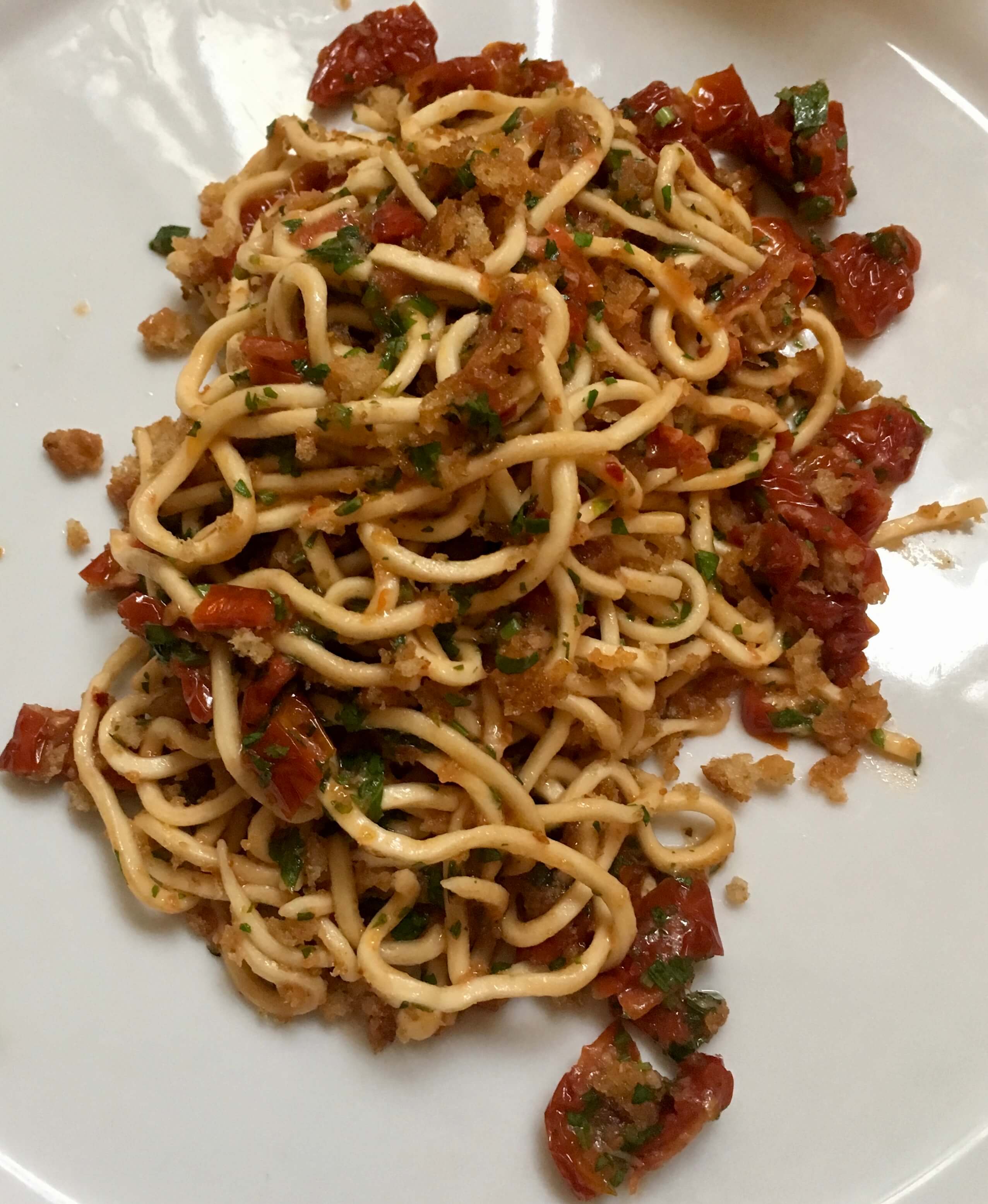 Vegan spaghetti alla chitarra at Libreria Brac in Florence, Italy