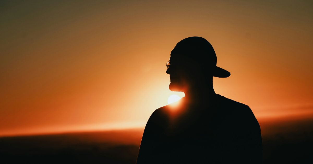 A man looking into the sunset