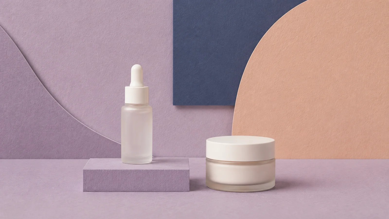 One treatment bottle and moisturizer arranged for a focused nighttime routine