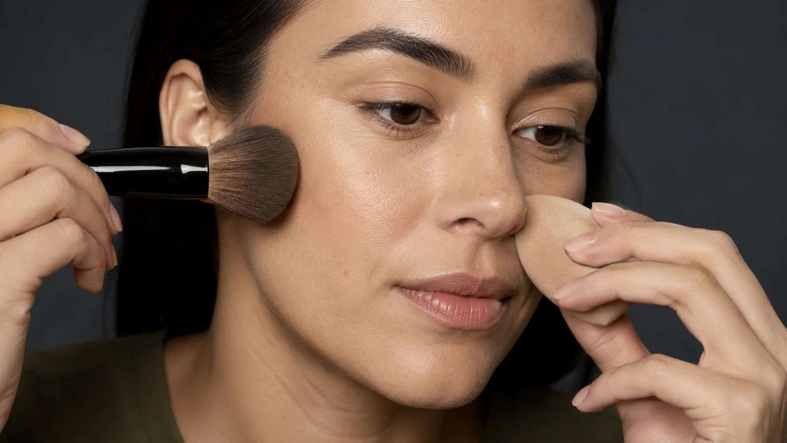 Powder foundation applied with a brush and liquid foundation blended with a sponge